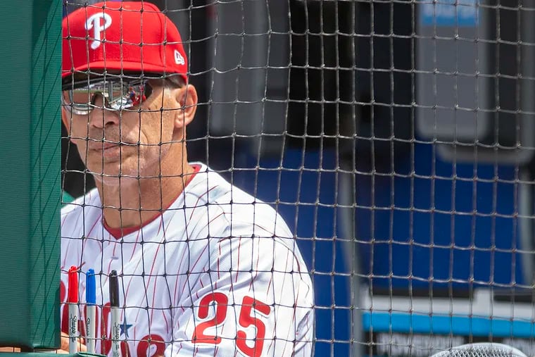 Phillies manager Joe Girardi looking on from inside the dugout during an April game. Girardi was fired by the Phillies on Friday.