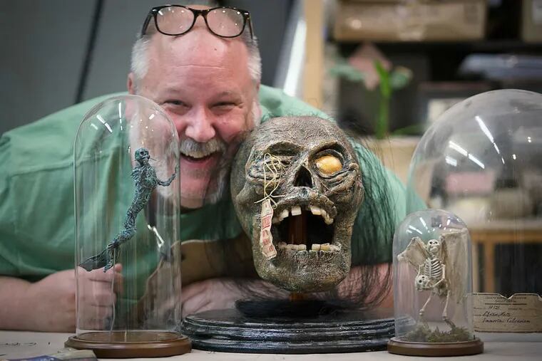 Props master Jay Duckworth in his workshop. He created his toothy friend, he says, "to show what happens when you have to make a shrunken head out of a zombie."