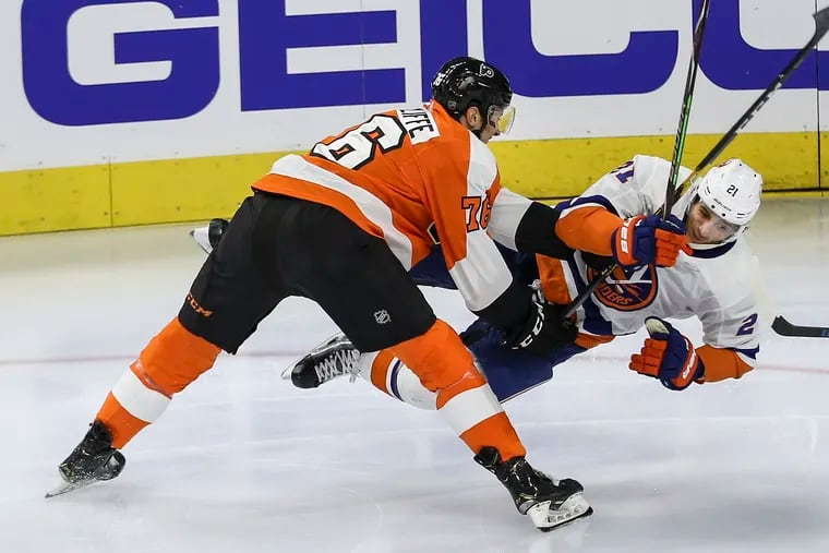 Big left winger Isaac Ratcliffe, shown knocking down the Islanders' Luca Sbisa during an exhibition game this season, is one of the Flyers' top prospects.