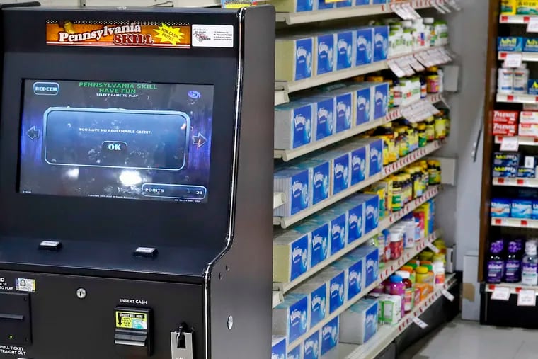 A Pennsylvania Skill brand game terminal, left, is available to play at a grocery store in Harmony, Pa.