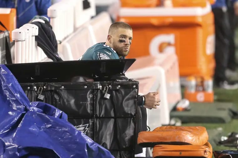 Zach Ertz watches as the field clears after the loss to Washington.