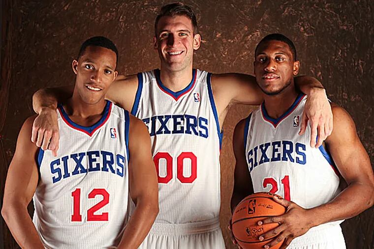 The 76ers' Evan Turner, Spencer Hawes and Thaddeus Young. (Steven M. Falk/Staff Photographer)