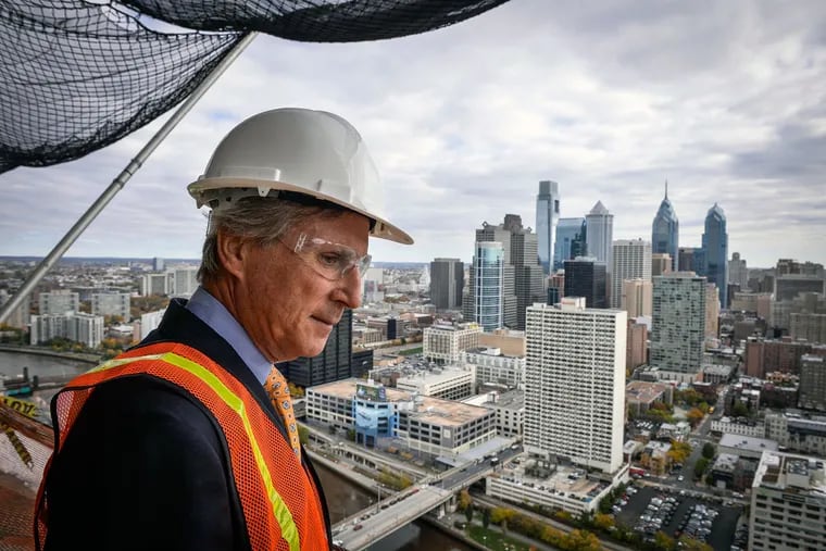 Brandywine Realty Trust CEO Jerry Sweeney looks out on the city while on a tour of the new Cira Green parking garage green roof and the ongoing FMC Tower construction in West Philadelphia.