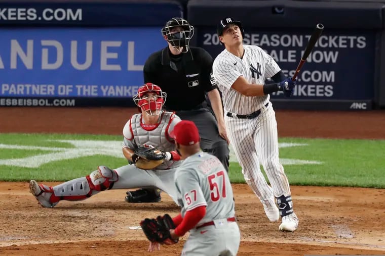 The Yankees' Gio Urshela watches his three-run home run leave the park in the sixth inning off Phillies reliever Deolis Guerra.