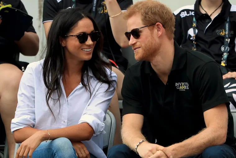 Prince Harry and Meghan Markle watch Wheelchair Tennis at the 2017 Invictus Games in Toronto.