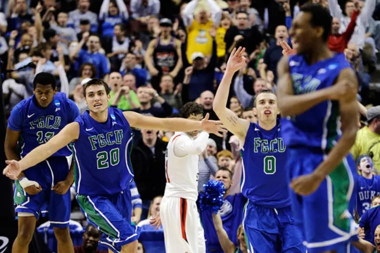Florida Gulf Coast's Eric McKnight, from left, Chase Fieler, Brett Comer and Bernard Thompson celebrate after a dunk by McKnight late the second half of a third-round game against San Diego State in the NCAA college basketball tournament, Sunday, March 24, 2013, in Philadelphia. Florida Gulf Coast won 81-71. (Matt Slocum/AP)