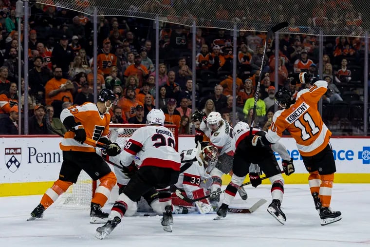 PhKevin Hayes (13), scores the first goal of the game against Claude Giroux and the Ottawa Senators on Saturday.