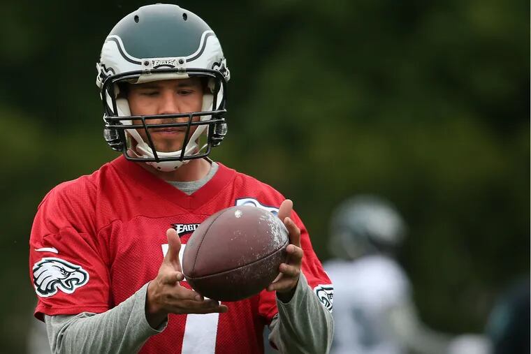 Eagles quarterback Sam Bradford gets a feel for the ball while working out with the team on Tuesday.