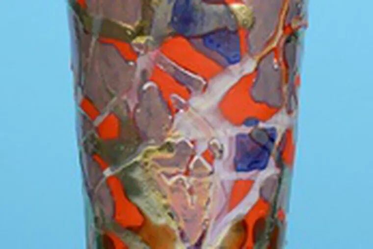 A Sicard lustre vase , left, and &quot;Red Nebula,&quot; a vessel created by Paul Katrich.