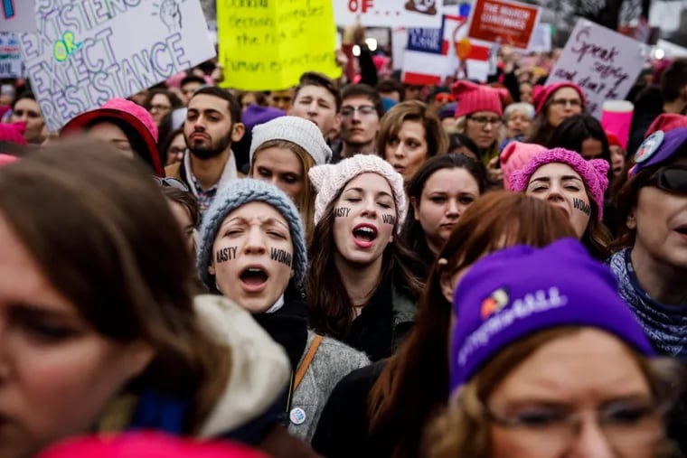Women sing along as thousands pack the streets for the Women’s March on Washington.