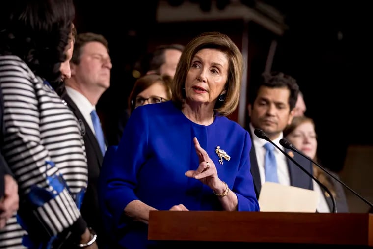 House Speaker Nancy Pelosi of Calif., accompanied by House Congress members speaks at a news conference to discuss the United States Mexico Canada Agreement (USMCA) trade agreement, Tuesday, Dec. 10, 2019, on Capitol Hill in Washington. (AP Photo/Andrew Harnik)