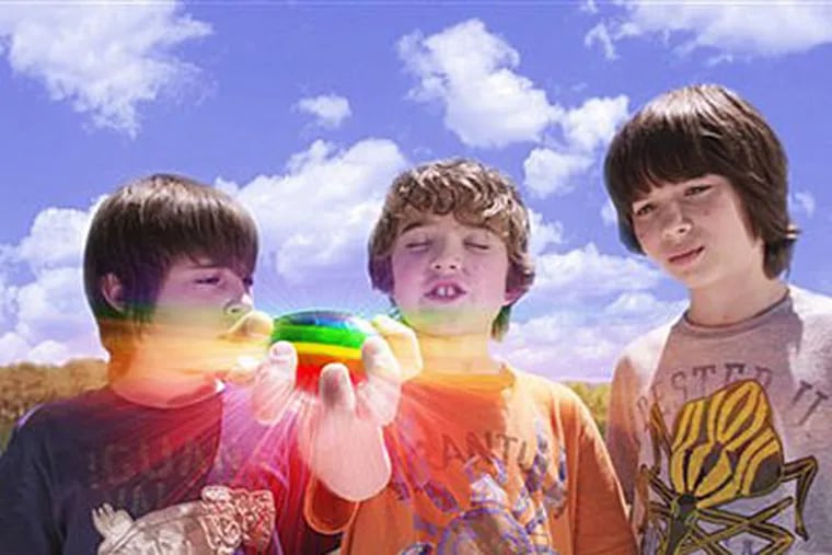 From left: Rebel Rodriguez, Leo Howard, and Trevor Gagnon play new friends who must join forces to undo the chaos caused by a rainbow-colored, wish-granting rock in "Shorts." (AP Photo/Warner Bros.)