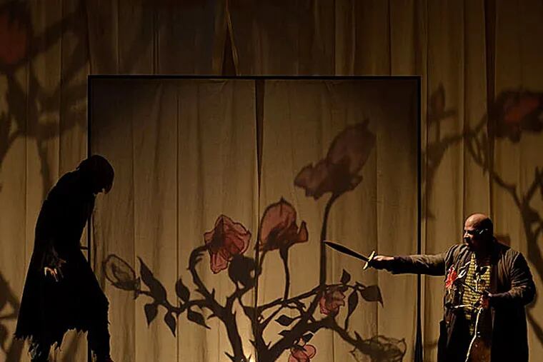 A shadowy Beast (Matteo Scammell) faces George Godwin (Brian Anthony Wilson) in the Arden's production of &quot;Beauty and the Beast.&quot; (MARK GARVIN)