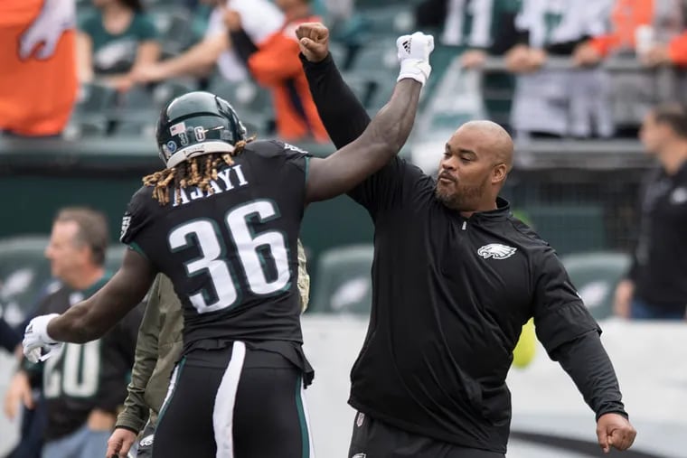 Eagles running back Jay Ajayi (left) with running backs coach Duce Staley before a game in 2017.