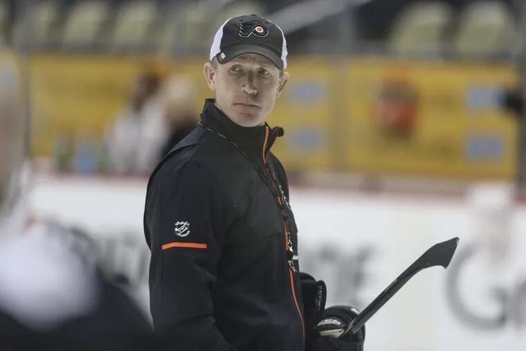Flyers' head coach Dave Hakstol skates during practice getting ready for game two with the Penguins at PPG Paints Arena in Pittsburgh . Thusday, April 12, 2018.