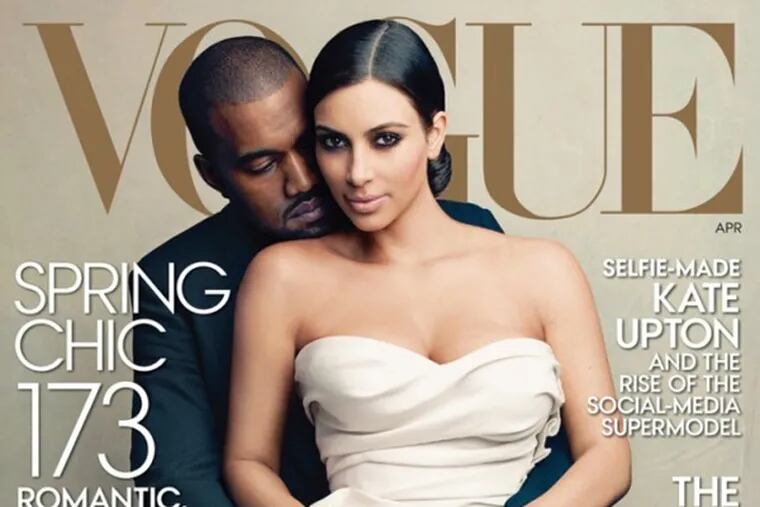 Kim Kardashian and Kanye West on the cover of Vogue magazine.