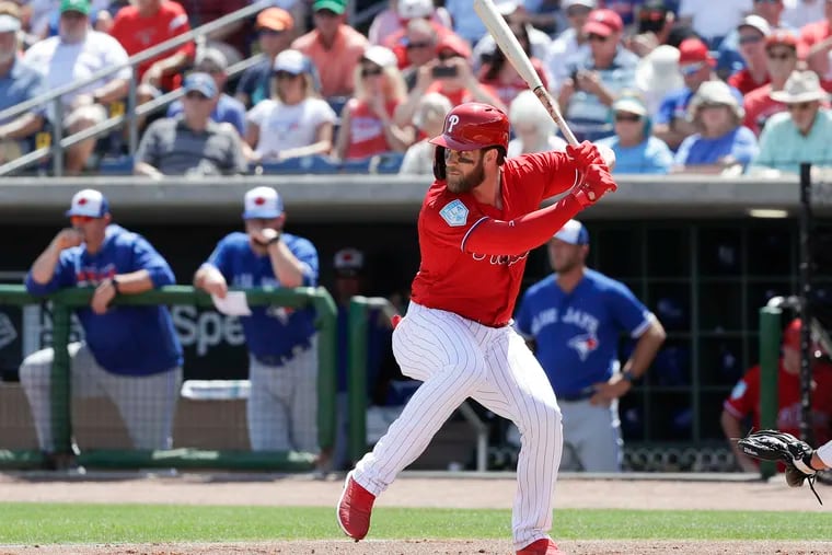 Phillies Bryce Harper bats against the Toronto Blue Jays during a spring training game at Spectrum Field in Clearwater, Fla.