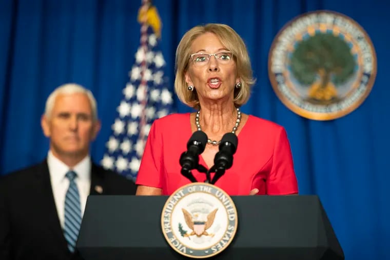 Education Secretary Betsy DeVos, with Vice President Mike Pence, speaks during a White House Coronavirus Task Force briefing at the Department of Education building Wednesday, July 8, 2020, in Washington.