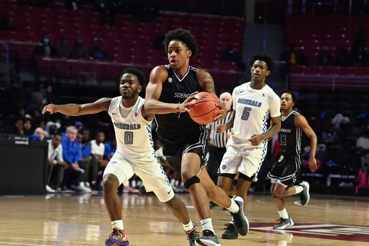 Math Civics & Sciences senior Sair Alsbrooks drives to the basket against Constitution on Tuesday at Temple’s Liacouras Center. MC&S won the Public League semifinal matchup, setting the stage for Saturday's final against Imhotep.