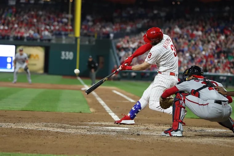 Bryce Harper of the Phillies hits a 3-run home run off of Stephen Strasburg of the Nationals in the 3rd inning at Citizens Bank Park on April 9, 2019.