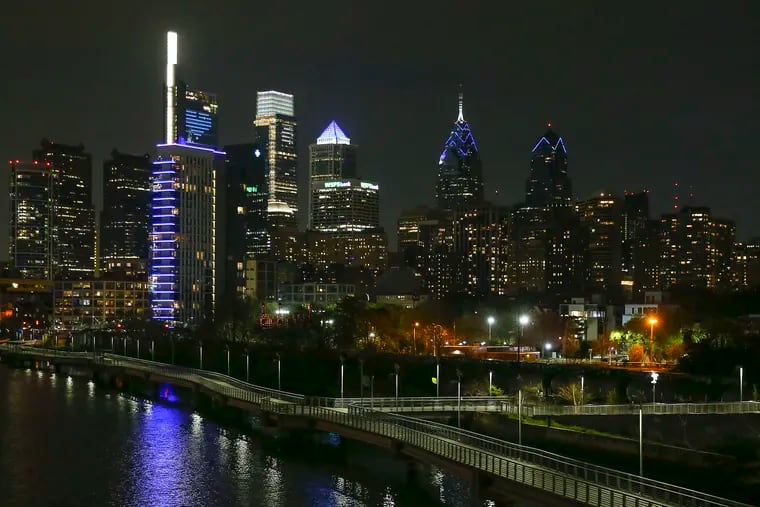 Buildings across Philadelphia lit up in blue Tuesday night in a show of support for health care workers, including a heart logo on one of Comcast's skyscrapers.