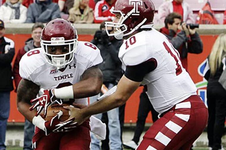 Temple quarterback Chris Coyer (10) hands off to running back Montel
Harris (8) during the first half of an NCAA college football game
against Louisville in Louisville, Ky., Saturday, Nov. 3, 2012. (AP
Photo/Garry Jones)