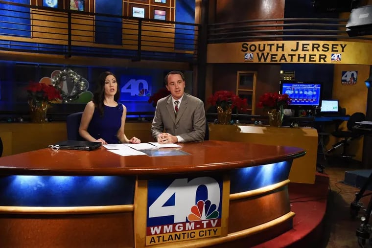 Former NBC40 news anchor Michelle Dawn Mooney, left, and weatherman Dan Skeldon offer up the 5 p.m. local news on the station on Dec. 23, 2014.  The station lost its NBC license and was later went dark.