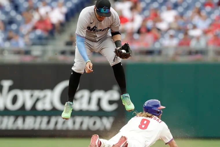 A diving Travis Jankowski steals second base during the Phillies' 7-4 win over the Miami Marlins Sunday at Citizens Bank Park.