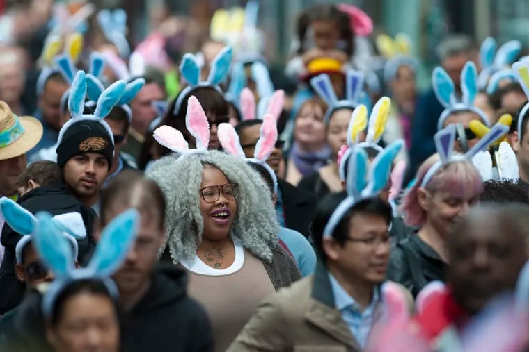 Rita Randolph (foreground with gray wig and glasses), Northeast Philly, is part of a sea of bunny ears parading down South Street during the 85th annual Easter Day Promenade March 27, 2016.     CLEM MURRAY / Staff Photographer