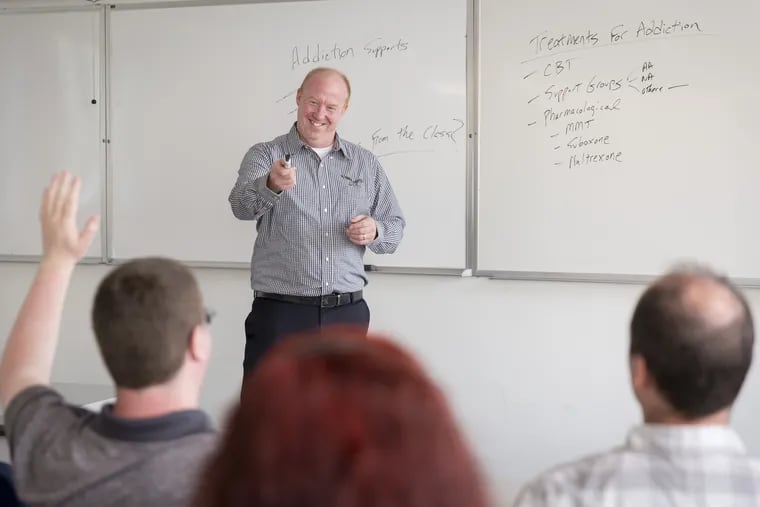 Pat McElwaine, program director and associate professor of the master's in counseling psychology program at Holy Family University, teaches a class.