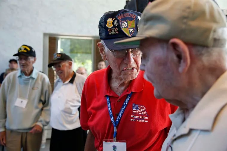 Marvin Boyenga, 90, second from right, talks with Quentin Waite, 95, at right, in front of the Liberty Bell. They are the last living members of Merrill’s Marauders, a unit famous for its behind-the-lines exploits during World War II. Four members from the group tour Philadelphia, PA on August 26, 2016.  DAVID MAIALETTI / Staff Photographer