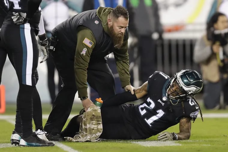 Eagles cornerback Ronald Darby lays on the field getting help with a third-quarter injury against the Dallas Cowboys on Sunday, November 11, 2018 in Philadelphia.