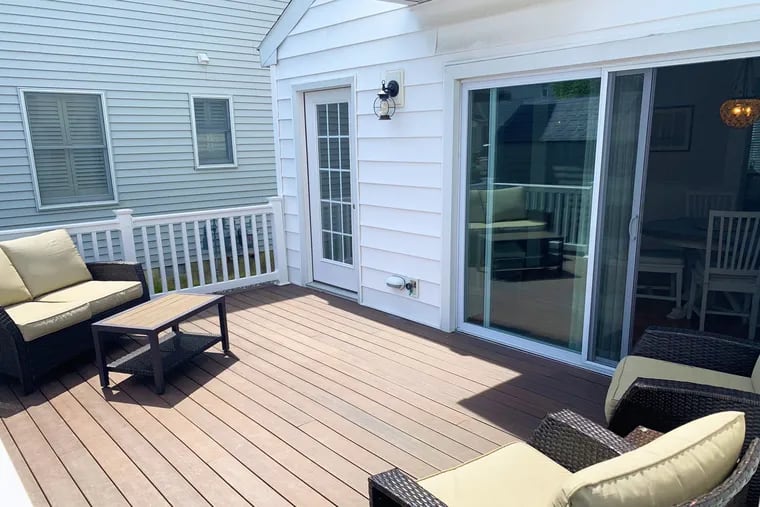 The two-story condo has a back deck accessible through a mudroom.
