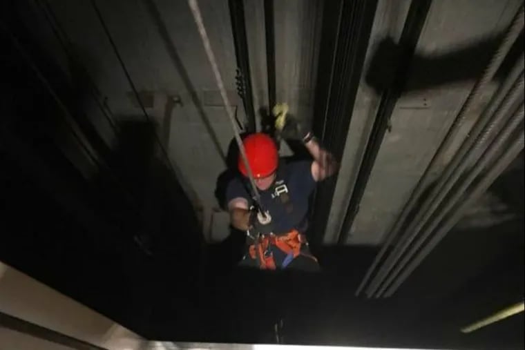 An Atlantic City firefighter is lowered into an elevator shaft to rescue one of 14 passengers who were stuck for hours at the Tropicana Hotel and Casino.