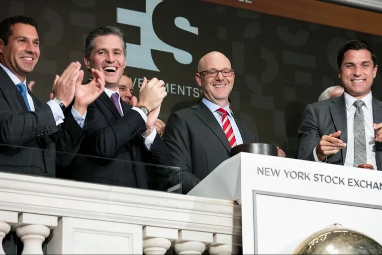 Philadelphia-based FS Investments CEO Michael Forman, second from right, ringing the closing bell at the New York Stock Exchange.