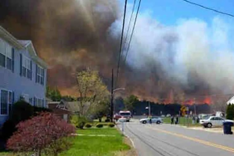 Photo of fire threatening homes in Beechwood, Ocean County, posted on Twitter by @kaylaxjean5