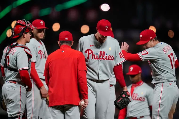 Phillies starting pitcher Kyle Gibson, second from right, is pulled from the game against the San Francisco Giants during the second inning Friday in San Francisco.