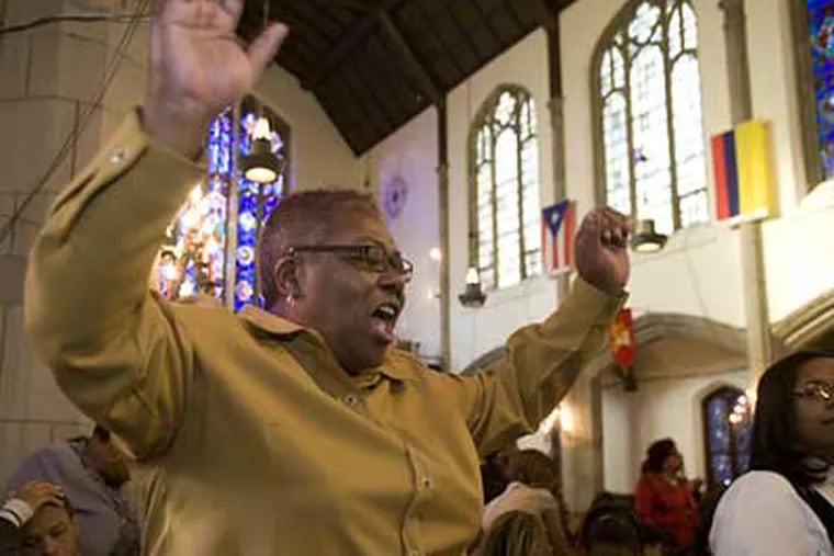 Jackie McDuffie celebrates the election of Barack Obama during morning worship at the Harold O. Davis Memorial Baptist Church. (Ed Hille / Staff Photographer)
