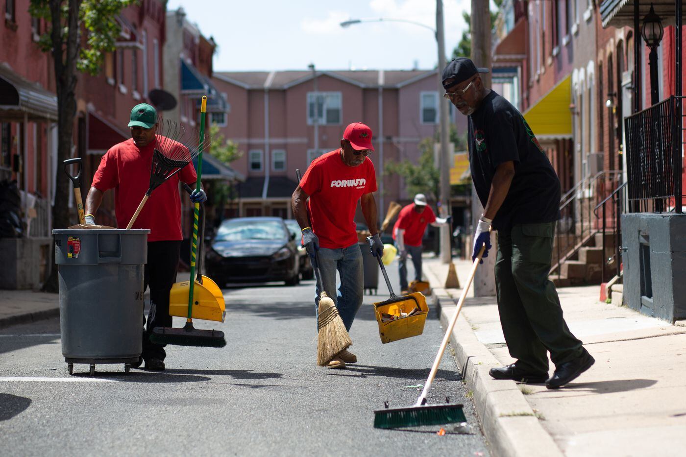 Who are those men in Tshirts and hats, cleaning North Philly to repair