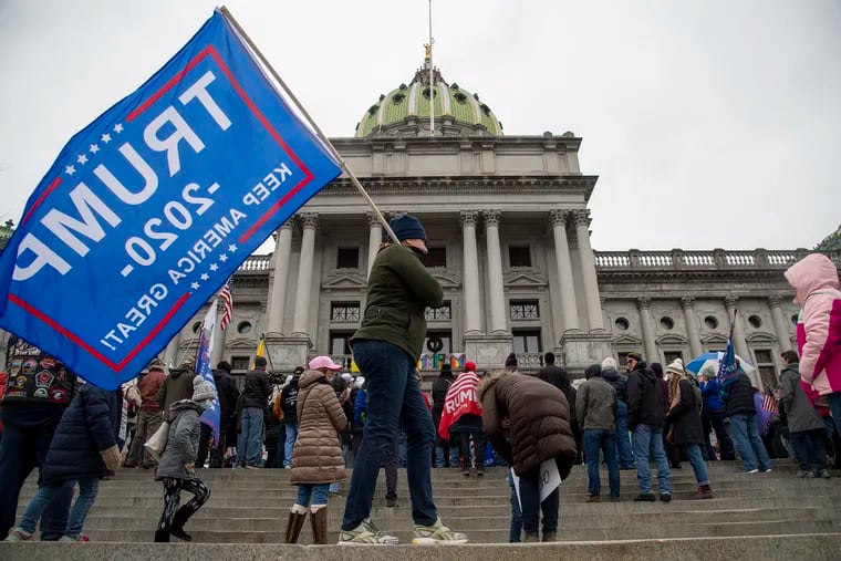 Supporters of then-President Donald Trump rally on the steps of the Pennsylvania State Capitol building in Harrisburg on Jan. 5 to protest Congress' planned certification of Joe Biden's election win the next day. Election law is one of the issues that have come to blend longstanding political disputes with new grievance as Pennsylvania Republicans give cultural fights their most vocal attention.