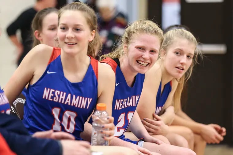 Neshaminy's Kristin Curley (center) said she will miss her teammates and the competition when she stops playing basketball and soccer in college.