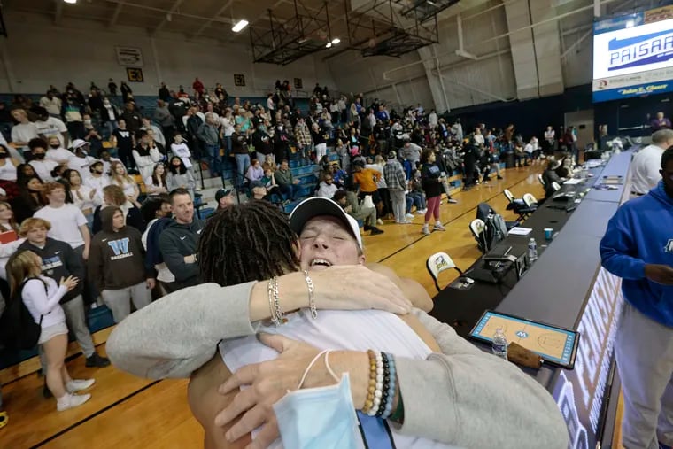 Kathy Drysdale hugs her son, Westtown’s Dereck Lively, after the Westtown vs. Perkiomen School PAISAA boys basketball state championship game at La Salle’s Tom Gola Arena on March 5, 2022.  Westtown won the game 46-41.