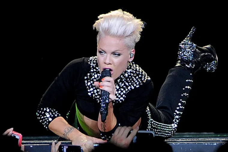 Pink put on a display of impressive kinetic creativity as she scampered all over her expansive cantilevered stage.