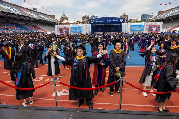 Graduates looking for family after the finish of the 2024 graduation for the University of Pennsylvania held at Franklin Field on Monday, May 20.