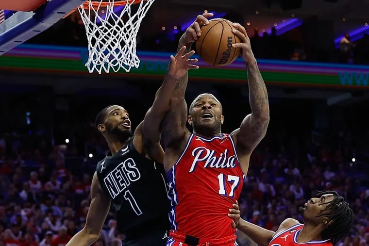 Sixers forward P.J. Tucker grabs an offensive rebound in the second quarter. Tucker had five offensive rebounds and seven total.