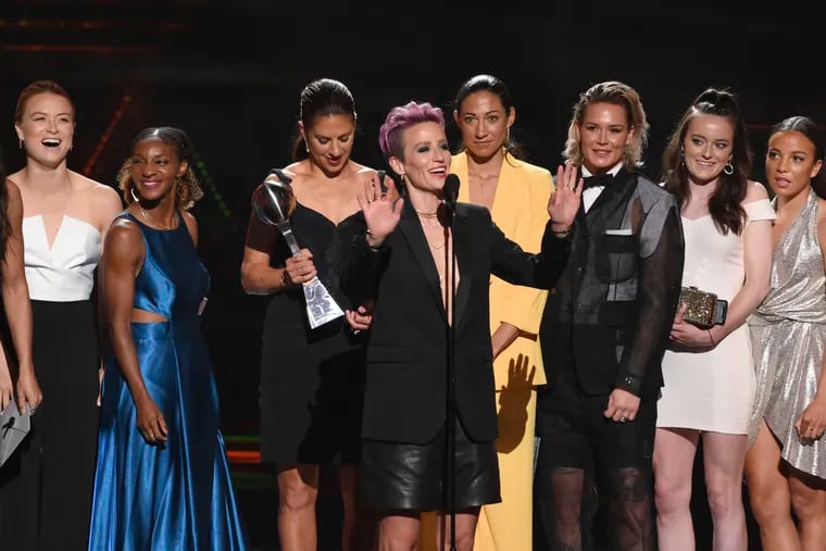 Megan Rapinoe, center, and members of the U.S. women's national soccer team accept the award for best team at the ESPY Awards on Wednesday, July 10, 2019, at the Microsoft Theater in Los Angeles.
