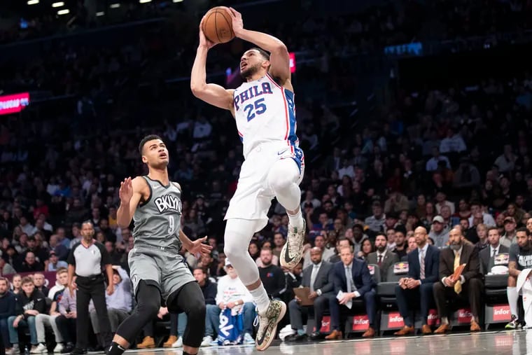Philadelphia 76ers guard Ben Simmons (25) goes to the basket past Brooklyn Nets guard Chris Chiozza (9) during the first half of an NBA basketball game, Monday, Jan. 20, 2020, in New York. (AP Photo/Mary Altaffer)