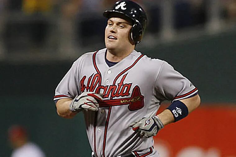 Atlanta's Matt Diaz rounds the bases after hitting a two-run homer in the sixth inning. (H. Rumph Jr/AP)