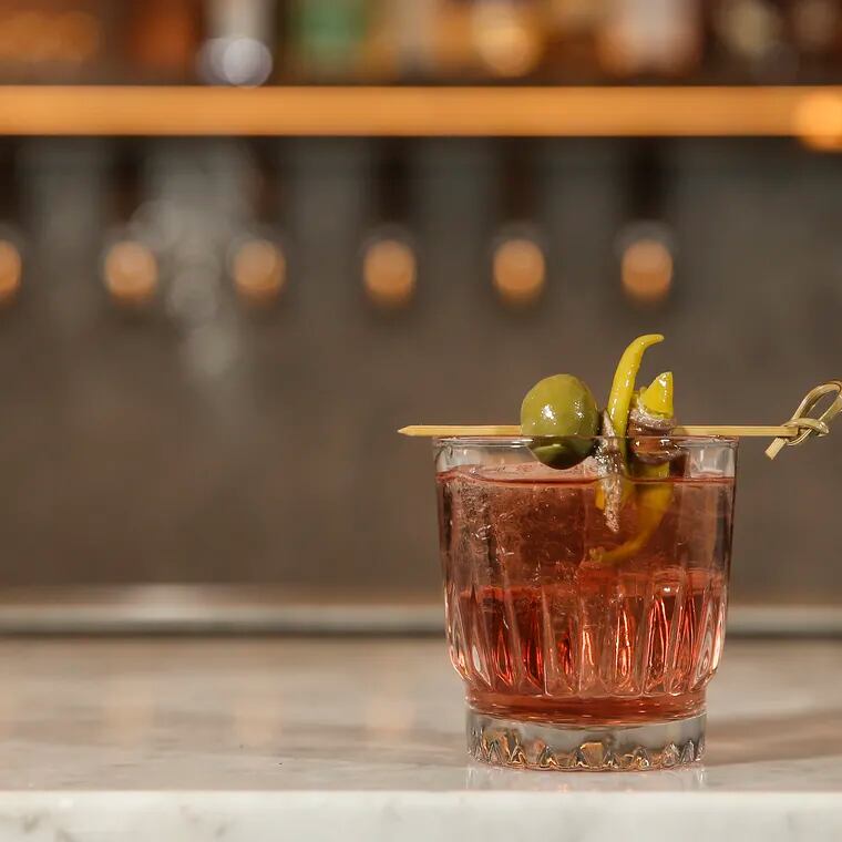 Fell to Earth, Pennsylvania's first vermoutherie, is holding a popup bar in Headhouse Square's Bodhi Coffee on Tuesdays and Wednesdays in March 2024. It's also moving into a production space in East Falls. Here, Batch #5 of Dumpster Juice Vermouth on the rocks.