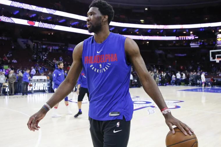 Sixers center Joel Embiid dribbles the basketball during warm-ups before the Sixers play the Miami Heat in game two of the Eastern Conference quarterfinals on Monday, April 16, 2018 in Philadelphia.